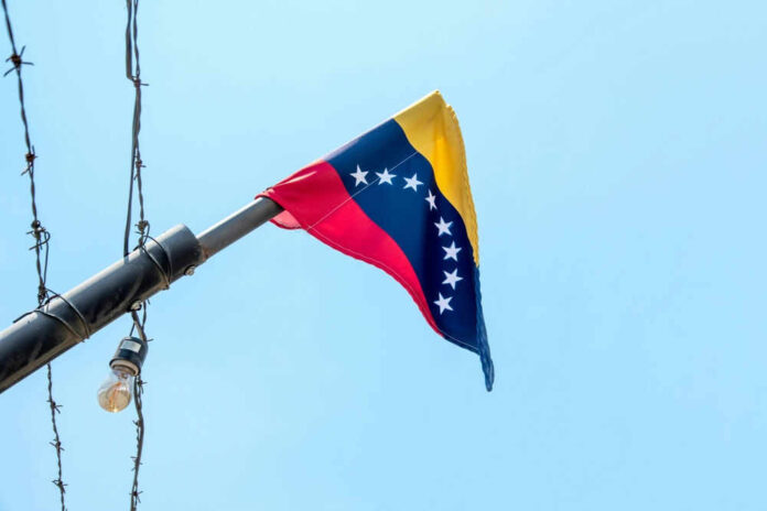 2495002381 Venezuelan flag flying on a pole.