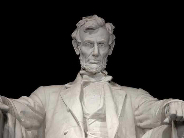 Marble statue of Abraham Lincoln seated with a serious expression