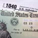 Bold Trump Move – $2,000 Checks Without Taxes? Close-up of a U.S. Treasury check and tax form 1040