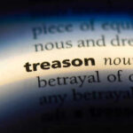 The word treason highlighted in a dictionary.