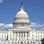 Congressman’s Trading SCANDAL — Massive Returns Exposed U.S. Capitol building against blue sky.