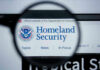 Over 4,500 ICE and Border Patrol Agents Info Leaked Online! Magnifying glass showing Homeland Security website.