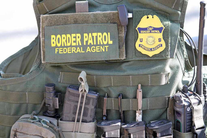 1646704639 Border Patrol vest with gear and communication equipment.