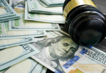 Jack Smith GRILLED Over $650K Billing Bombshell Gavel and hundred dollar bills on table.