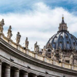 Trump’s Bold VATICAN Invitation—Will Pope ACCEPT? St. Peters Basilica dome with statues and clouds.