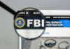 FBI’s Most Wanted CAUGHT – Unbelievable Escape Ends FBI website shown through magnifying glass.