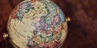 Close-up of a vintage globe showing continents and oceans