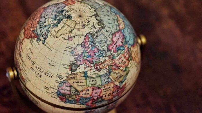 Close-up of a vintage globe showing continents and oceans