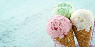 Three ice cream cones with different flavors in a pink basket