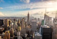 Aerial view of New York City skyline featuring the Empire State Building at sunset