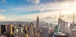 Aerial view of New York City skyline featuring the Empire State Building at sunset
