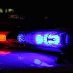 Close-up of police lights flashing in blue and red at night