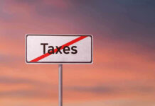 SHOCKING Analysis: Income Taxes Could Disappear Completely Sign with the word Taxes crossed out.