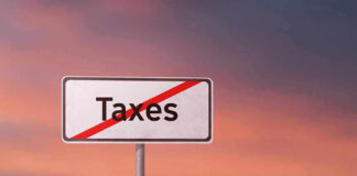 Sign with the word Taxes crossed out.
