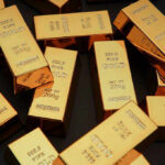 Broken Seals at Fort Knox — WHERE’S THE GOLD? Gold bars stacked on dark background