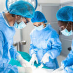 Surgeons performing an operation in a sterile environment.
