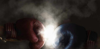 Red and blue boxing gloves clashing with smoke.