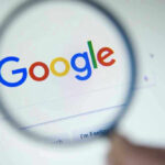 Trusted Engineers LOOTED Google — FBI Investigation Explodes Google logo viewed through a magnifying glass.