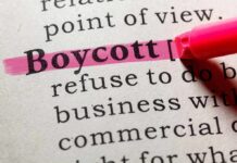 Highlighted definition of the word 'boycott' in a dictionary