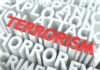 The word 'TERRORISM' prominently displayed in red among other related terms