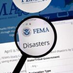 FEMA website with a focus on disaster information under a magnifying glass