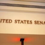 Sign displaying United States Senate in a government building