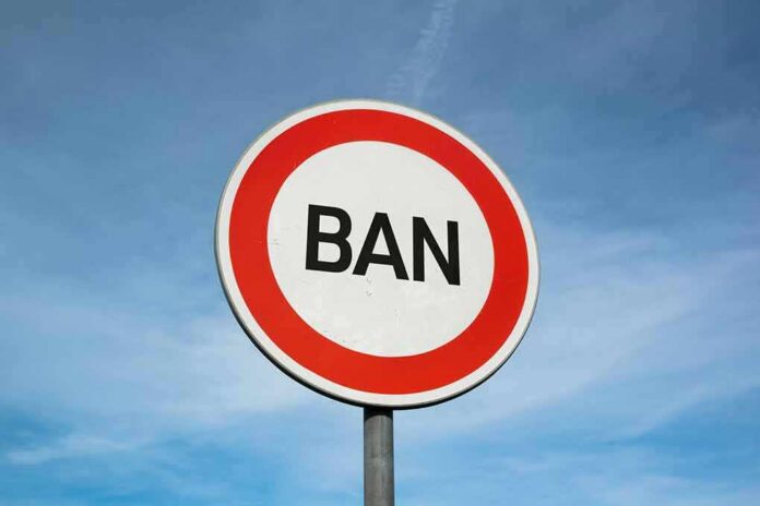 A road sign displaying the word 'BAN' against a blue sky