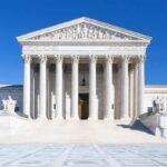 Birthright Citizenship SHOWDOWN Hits Supreme Court PRECEDENT The Supreme Court building featuring marble columns and a clear blue sky