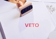 A stamp with the word 'VETO' in red ink on a white document
