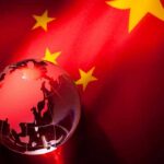 Free Speech CRUSHED: Hong Kong Drops Hammer A globe illuminated against the backdrop of the Chinese flag