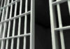 Ankle Monitor FAIL — Woman Murdered ANYWAY Close-up of prison cell bars.