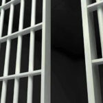 Ankle Monitor FAIL — Woman Murdered ANYWAY Close-up of prison cell bars.