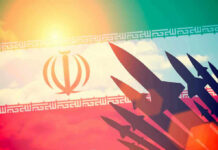 $30M Reaper DROPPED Over Iran Silhouettes of missiles over Irans flag graphic.