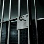 Convicted TV Actor FOUND DEAD—Disturbing New Questions Close-up of a locked prison gate with metal bars