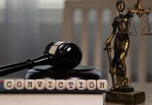 A gavel and the word 'CONVICTION' spelled with wooden blocks