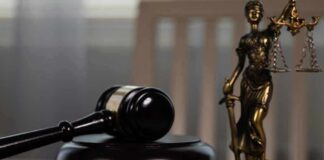 A gavel and the word 'CONVICTION' spelled with wooden blocks