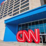 CNN’s Own Host SLAMS Network’s Coverage Exterior view of the CNN headquarters with a large red logo and blue entrance
