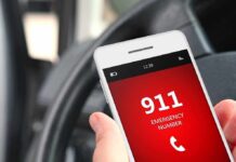 Teen Mob Overwhelms Lone Clerk A smartphone displaying the emergency number 911 while held in a persons hand inside a car