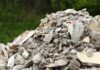 A large pile of construction debris consisting of broken concrete and other materials