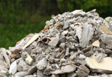 A large pile of construction debris consisting of broken concrete and other materials