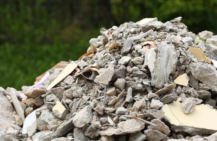 A large pile of construction debris consisting of broken concrete and other materials