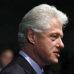What CLINTON Just Admitted Under Oath Profile portrait of a man with gray hair in formal attire