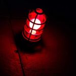 Cuba’s Power Grid COLLAPSES – 10 Million in Peril A red lantern emitting a warm glow in a dark setting