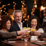 Gunmen SLAUGHTERS Eight—Illegal BAR Blood Bath People laughing while clinking glasses at a bar