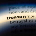 U.S. CITIZEN Millionaire Arrested — Secret Iranian Arms Network EXPOSED The word treason highlighted in a dictionary.