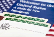 Permanent resident cards with welcome guide and flag.