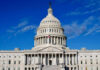 US Capitol Building against blue sky.
