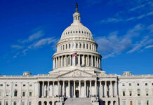 US Capitol Building against blue sky.