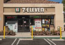 Exterior view of a 7-Eleven convenience store with an ATM