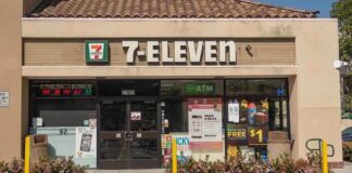 Exterior view of a 7-Eleven convenience store with an ATM